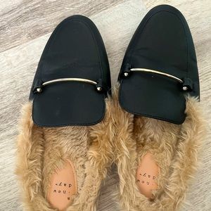 Black mules with faux fur.